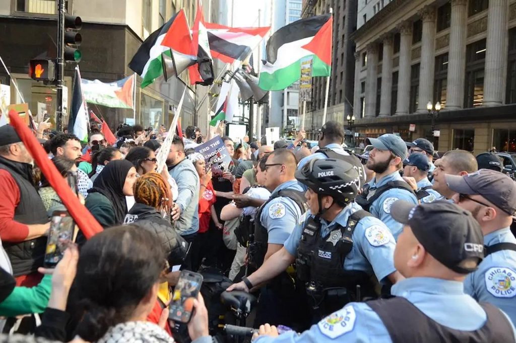 US police forcibly remove headscarf of woman taking part in pro-Palestine protest