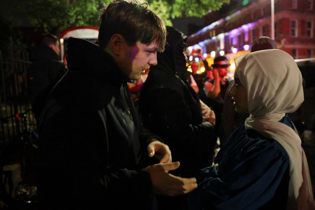 ‘Love will prevail’: how a far-right rally in Liverpool was defused